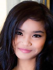 Really pretty and petite Thai girl Panni strips to show her body