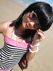 Cute little Thai amateur Febe poses at the beach and flashes